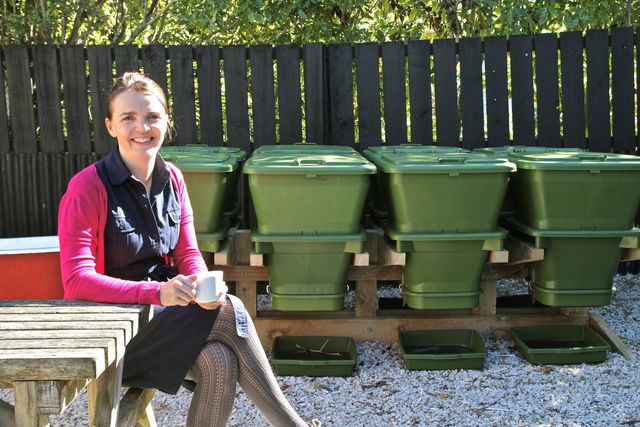 Hungry Bin Worm Farm - Angie Redfern, Owner of Ripe Café in Auckland enjoys a coffee in the cafe's garden. 